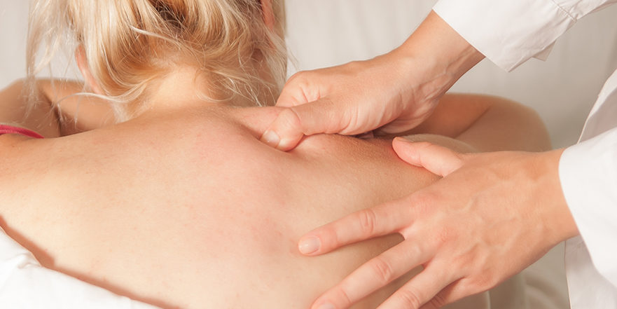 woman receiving trigger point massage therapy